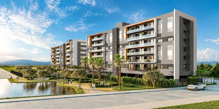 Perspectiva do Santorini, em Xangri-Lá: edifício residencial entre jardins e um lago